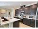 Modern kitchen with stainless steel appliances and an island at 3393 Kacher Rd, North Port, FL 34288