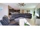 Spacious living area with a large sectional sofa and ceiling fan at 3393 Kacher Rd, North Port, FL 34288