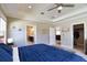 Spacious main bedroom features a tray ceiling, ceiling fan, ensuite bath and walk-in closet at 3393 Kacher Rd, North Port, FL 34288