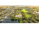 Aerial view of house and surrounding neighborhood, near a lake at 3409 Carpel St, Plant City, FL 33566