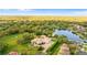 Luxury home with a large backyard, pool, and lake views at 3409 Carpel St, Plant City, FL 33566