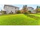 Expansive grassy backyard with mature trees and home addition at 3409 Carpel St, Plant City, FL 33566