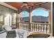 Relaxing balcony with wicker furniture and views of the backyard at 3409 Carpel St, Plant City, FL 33566