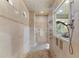 Large walk-in shower with multiple shower heads and a bench at 3409 Carpel St, Plant City, FL 33566