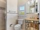 Well-appointed bathroom with tiled shower and vanity with mirrored drawers at 3409 Carpel St, Plant City, FL 33566