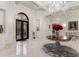 Elegant entry with double doors, chandelier, and marble floors at 3409 Carpel St, Plant City, FL 33566