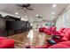 Spacious home theater with seating, large screen, and built-in cabinetry at 3409 Carpel St, Plant City, FL 33566
