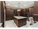 Large kitchen with ample cabinetry, granite island, and high-end appliances at 3409 Carpel St, Plant City, FL 33566