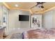 Large main bedroom with TV, seating area, and views into other rooms at 3409 Carpel St, Plant City, FL 33566