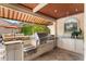 High-end outdoor kitchen with built-in grill at 3409 Carpel St, Plant City, FL 33566