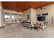 Spacious covered patio with seating and a TV at 3409 Carpel St, Plant City, FL 33566
