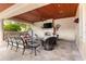 Outdoor patio with fireplace and seating area at 3409 Carpel St, Plant City, FL 33566