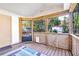 Relaxing screened porch with wood flooring at 4201 S Covina Cir, Tampa, FL 33617