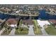 Property view showcasing a canal-front location and neighboring houses at 430 Monaco Dr, Punta Gorda, FL 33950