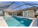 Spacious pool area with screened enclosure and patio access at 430 Monaco Dr, Punta Gorda, FL 33950