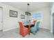 Bright dining room with table and chairs near a large window at 43930 Cattleman Dr, Punta Gorda, FL 33982