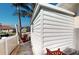 White storage shed with a single window and a wooden bench at 5247 Conner Ter, Port Charlotte, FL 33981