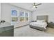 Large bedroom with plush carpeting, a king-size bed, and windows with pool views at 5640 Blue Reef Pl, Nokomis, FL 34275