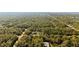 Aerial view showing two houses in a wooded area near the water at 14059 Gailwood Ave, Port Charlotte, FL 33953
