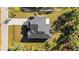 Overhead view of a house with a dark gray roof and a paved driveway at 14059 Gailwood Ave, Port Charlotte, FL 33953