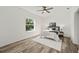 Spacious bedroom with ceiling fan and large window at 14059 Gailwood Ave, Port Charlotte, FL 33953