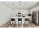 Modern kitchen with white cabinets, stainless steel appliances, and island at 14059 Gailwood Ave, Port Charlotte, FL 33953