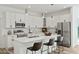 Modern kitchen features white cabinets and a large island at 14059 Gailwood Ave, Port Charlotte, FL 33953