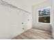 Laundry room with wire shelving and window at 14059 Gailwood Ave, Port Charlotte, FL 33953