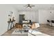 Bright living room with comfortable seating and wood floors at 14059 Gailwood Ave, Port Charlotte, FL 33953
