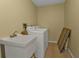 Laundry room with washer, dryer, and utility sink at 154 Hibiscus Dr, Punta Gorda, FL 33950