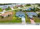 Charming single-Gathering home with a well-manicured lawn, mature trees, and a spacious backyard in a quiet neighborhood at 19983 Midway Blvd, Port Charlotte, FL 33948