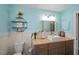 Bathroom with a wooden counter, vessel sink, decorative shelves, and light blue walls at 19983 Midway Blvd, Port Charlotte, FL 33948