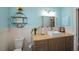 Coastal style bathroom with a white square sink and white wainscoting at 19983 Midway Blvd, Port Charlotte, FL 33948