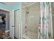 Small bathroom featuring a shower with a tropical print curtain at 19983 Midway Blvd, Port Charlotte, FL 33948