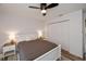 Bright bedroom featuring ceiling fan, neutral walls, and closet at 19983 Midway Blvd, Port Charlotte, FL 33948