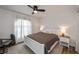 Bedroom with a neutral palette, a white bed frame, and soft, natural light from the window at 19983 Midway Blvd, Port Charlotte, FL 33948