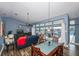 Dining room with patio access and view to outdoor pool at 19983 Midway Blvd, Port Charlotte, FL 33948