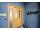 Close up of a decorative yellow door and welcome sign at 19983 Midway Blvd, Port Charlotte, FL 33948