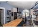 Contemporary kitchen featuring wood breakfast bar with stainless steel oven and large window at 19983 Midway Blvd, Port Charlotte, FL 33948