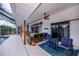 Spacious lanai with seating, ceiling fan, and convenient access to the pool area for outdoor enjoyment at 19983 Midway Blvd, Port Charlotte, FL 33948