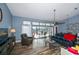 Bright living room with view to outdoor pool and patio area at 19983 Midway Blvd, Port Charlotte, FL 33948