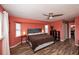 This spacious bedroom features a ceiling fan and two windows at 19983 Midway Blvd, Port Charlotte, FL 33948