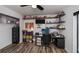 Well organized office featuring wood-look floors, shelves, and storage at 19983 Midway Blvd, Port Charlotte, FL 33948
