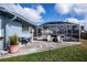 Charming pool area with screened enclosure, surrounded by lush landscaping and comfortable seating at 19983 Midway Blvd, Port Charlotte, FL 33948