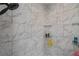 Shower featuring white marble-style tile and a rainfall showerhead at 19983 Midway Blvd, Port Charlotte, FL 33948