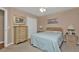 Comfortable bedroom with a queen-size bed and built-in storage at 2033 Northland Ave, North Port, FL 34288