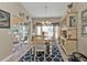 Elegant dining room with bay window, and a stylish area rug at 2033 Northland Ave, North Port, FL 34288