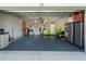 Organized garage with ample storage and overhead storage at 23071 Mineral Ave, Port Charlotte, FL 33954