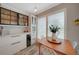 Small breakfast nook with white cabinets and wood table near pool at 2701 Bay Ct, Punta Gorda, FL 33950