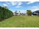 Peaceful canal view from the backyard with lush green grass at 2701 Bay Ct, Punta Gorda, FL 33950